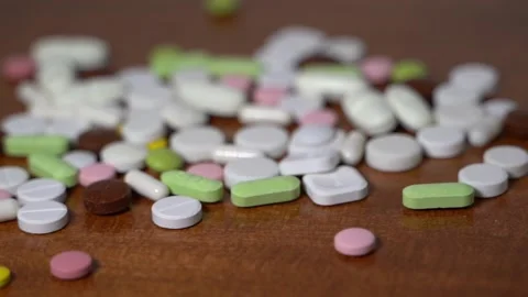Mixed pills, slow motion falling down and landing. Realistic 4k 3D Animation Stock Footage 141124686