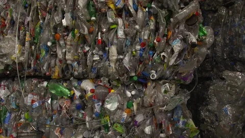 Mixed plastic bottles baled in warehouse and ready for recycling Stock Footage 93530240
