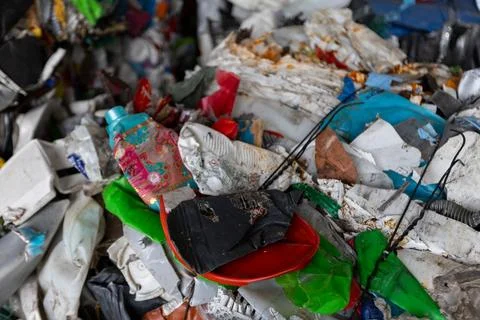 Mixed plastic waste prepared for sorting at recycling facility Stock Photos