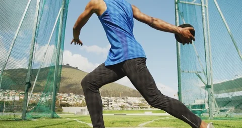 Mixed race athlete doing discus throw Stock Footage 124592873