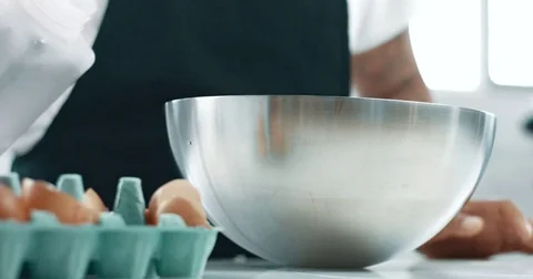 Mixed race baker makes a cake Stock Footage 77911046