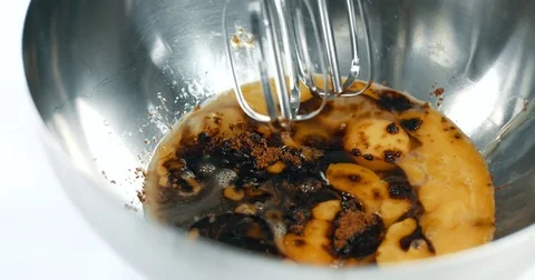 Mixed race baker makes a cake Stock Footage 77911480