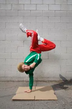 Mixed race boy breakdancing Stock Photos