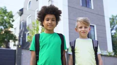 Mixed race boys looking at camera, best friends, happy childhood, togetherness 動画素材 117209076
