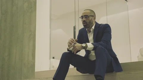 Mixed race businessman suicidal after embezzling millions of dollars Stock Footage 105018053
