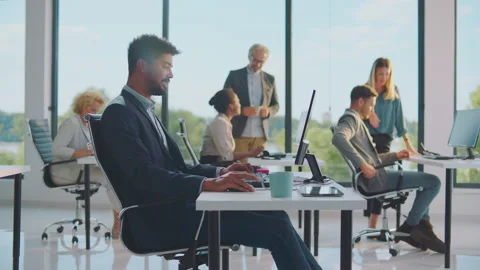 Mixed race businessman using computer Stock Footage 164590424