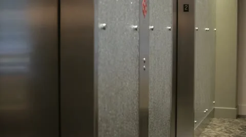 Mixed race businesswoman exiting elevator Stock Footage