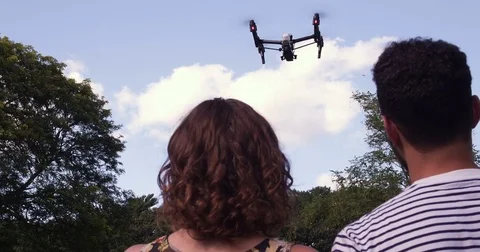 Mixed Race Couple Flying A Drone Stock Footage 80308435