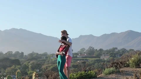 Mixed Race Couple Hugging and Taking Selfies In front Of  A Beautiful View Stock Footage 201821265
