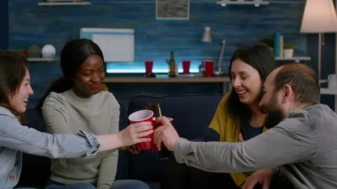 Mixed race friends talking while hanging... | Stock Video | Pond5
