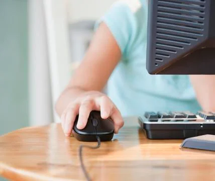 Mixed race girl using computer 스톡 사진