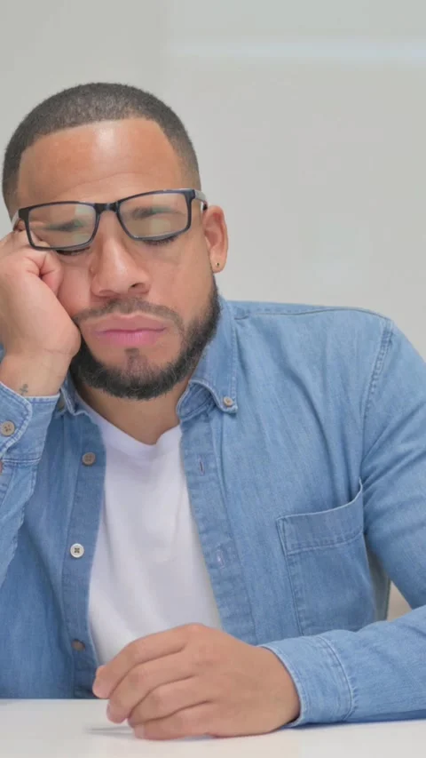 Mixed Race Man Sleeping in Office, vertical video Video stock 325700451