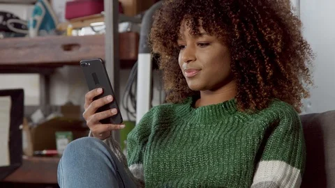 Mixed race model with mobile phone smiling Stock Footage 102899628