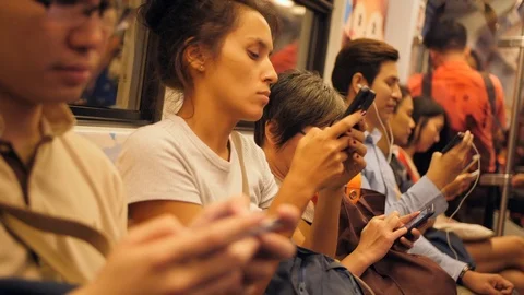Mixed Race People Using Smart Phones and Gadgets Inside Subway Train. 4K Stock Footage 115367563
