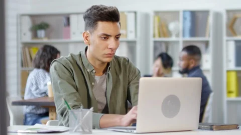 Mixed Race Software Developer Working on Laptop Stock Footage 111056596
