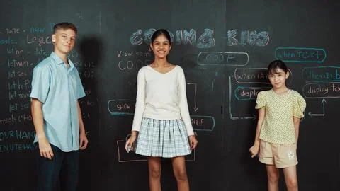 Mixed race student planning to code program by using blackboard. Edification. Foto stock