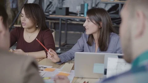 Mixed race team working together on architectural design in modern co-working Video stock 75049632