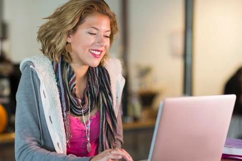 Mixed race teenage girl using laptop 스톡 사진