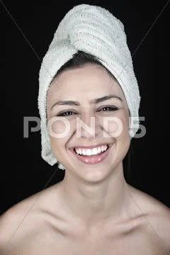 Mixed Race Teenager With Head Wrapped In A Towel