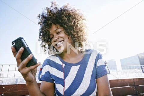 Mixed Race Woman Using Cell Phone