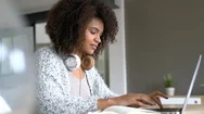 Mixed-Race Woman Working From Home On Laptop Computer Stock Footage