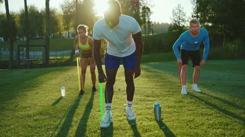 Mixed-race young athletes training together in team outdoors. Professional Stock Footage 139585197
