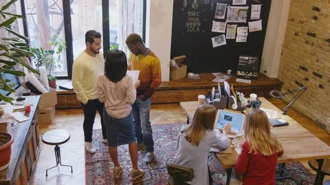 Mixed Raced Designers Working on Interior Project in Office Stock Footage 115444021