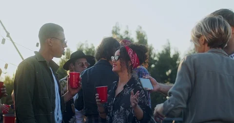Mixed-races young guy and girl talking w... | Stock Video | Pond5