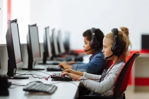 Mixed Racial group Of Elementary School Children In Computer Class Stock Photos