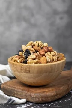 Mixed raw nuts. Special mixed nuts in bowl. Hazelnut, almond, cashew, pistach Stock Photos