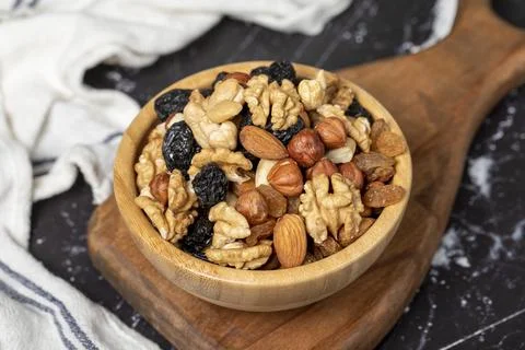 Mixed raw nuts. Special mixed nuts in bowl. Hazelnut, almond, cashew, pistach Stock Photos