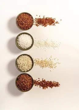 Mixed raw rice on white table. Vertical. Top view. Place for text. Copy space Stock Photos