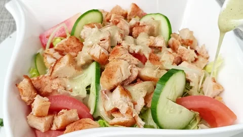Mixed salad with chicken and raw vegetables, close-up Stock Footage 295054888