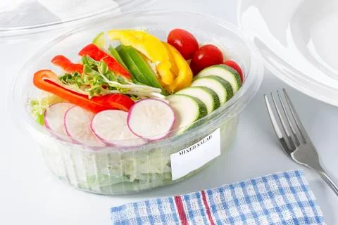 Mixed salad in a plastic box. Stock Photos