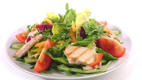 Mixed Salad on a Plate with grilled Chicken isolated on white background Stock Footage 188683003