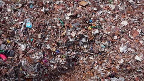 Mixed scrap fragments cover ground as sharp edges glint and textures crowd Stock Footage 319953126