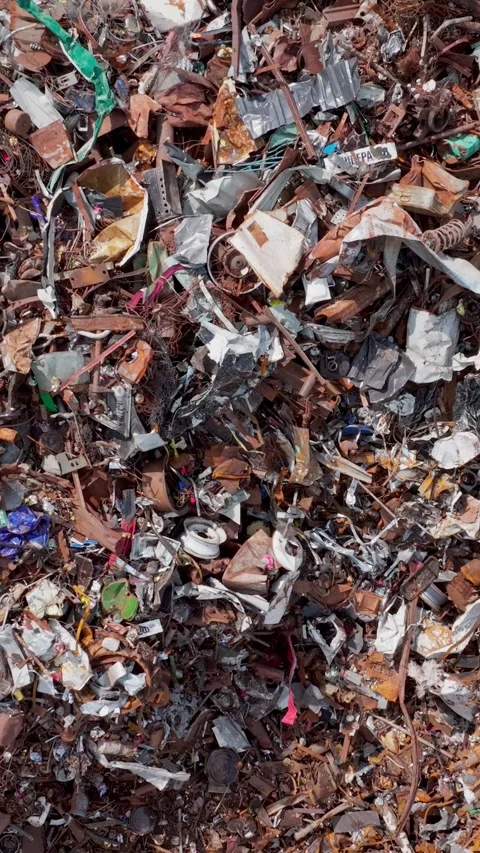 Mixed scrap fragments cover ground as sharp edges glint and textures crowd Stock Footage 321768427