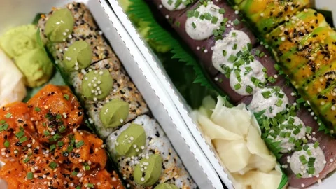Mixed Set of Various Maki Sushi with Salmon, Tuna Fish Topped with Sauce, Cheese Stock Footage 233213597