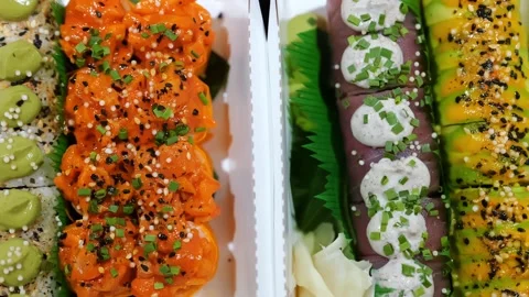 Mixed Set of Various Maki Sushi with Salmon, Tuna Fish Topped with Sauce, Cheese Stock Footage 233213640