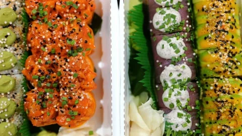 Mixed Set of Various Maki Sushi with Salmon, Tuna Fish Topped with Sauce, Cheese Stock Footage 233213719