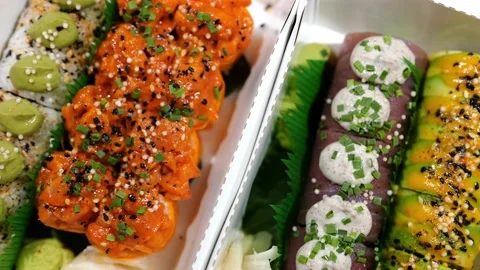 Mixed Set of Various Maki Sushi with Salmon, Tuna Fish Topped with Sauce, Cheese Stock Footage 233213846