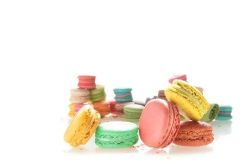 Mixed size of french macarons on white background Stock Photos