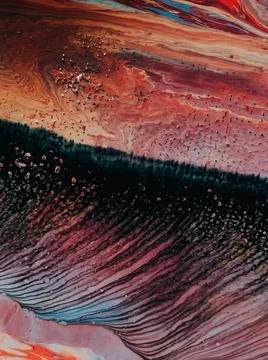 Mixed stains creating an abstract pattern in the water - a cool background 写真素材