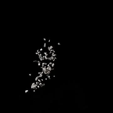 Mixed stone explosion on black background. Stock Photos