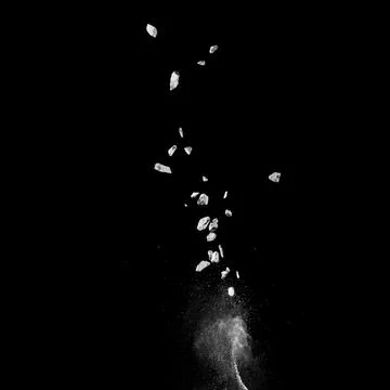 Mixed stone explosion on black background. Stock Photos