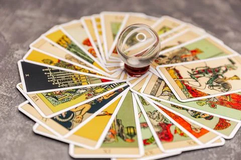 Mixed tarot cards on the table with a magic orb. Future reading Fotos de archivo