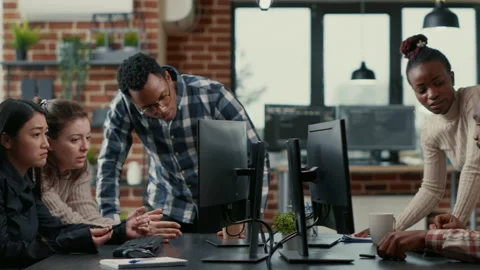 Mixed team of programmers brainstorming ideas for new cloud computing user Video stock 168241060