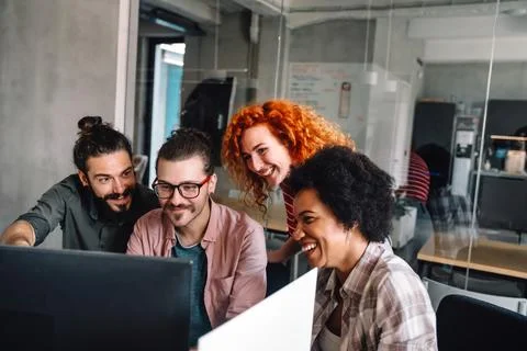Mixed team of software engineers brainstorming ideas. Diverse app developers Stock Photos