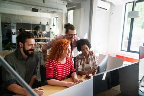 Mixed team of software engineers brainstorming ideas. Diverse app developers 库存照片