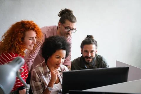 Mixed team of software engineers brainstorming ideas. Diverse app developers Stock Photos